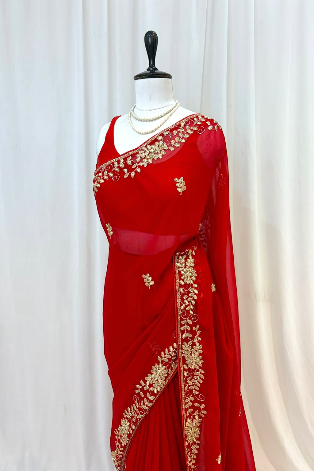 Red georgette zari embellished saree