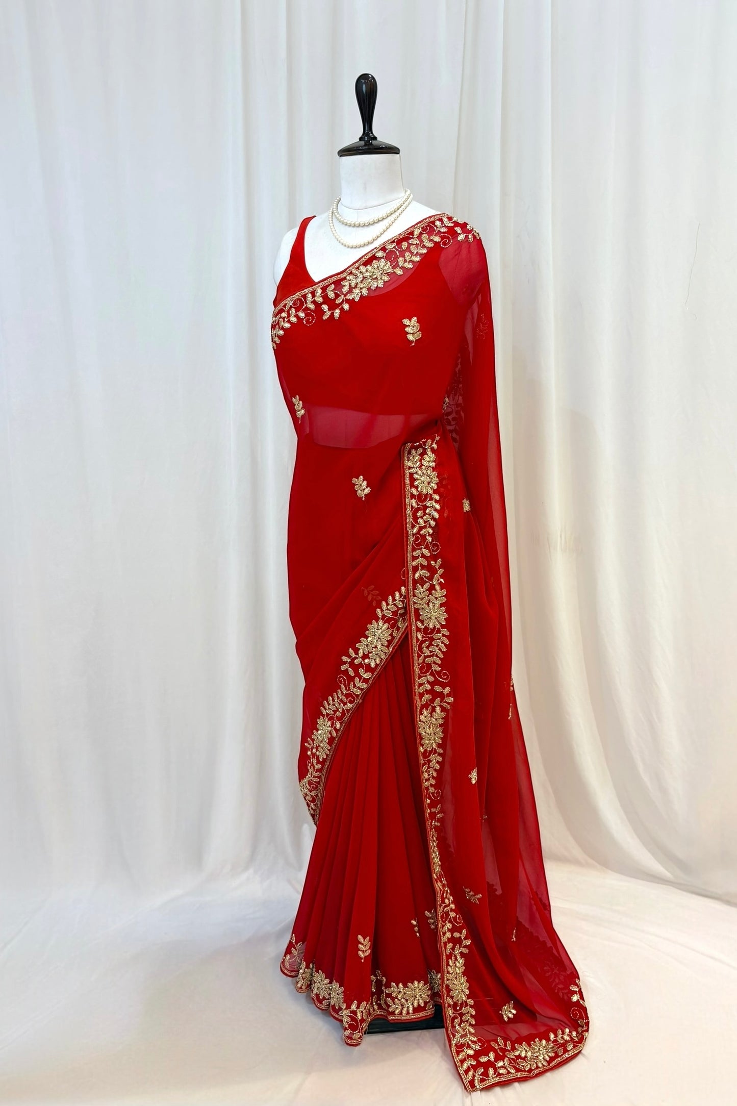 Red georgette zari embellished saree