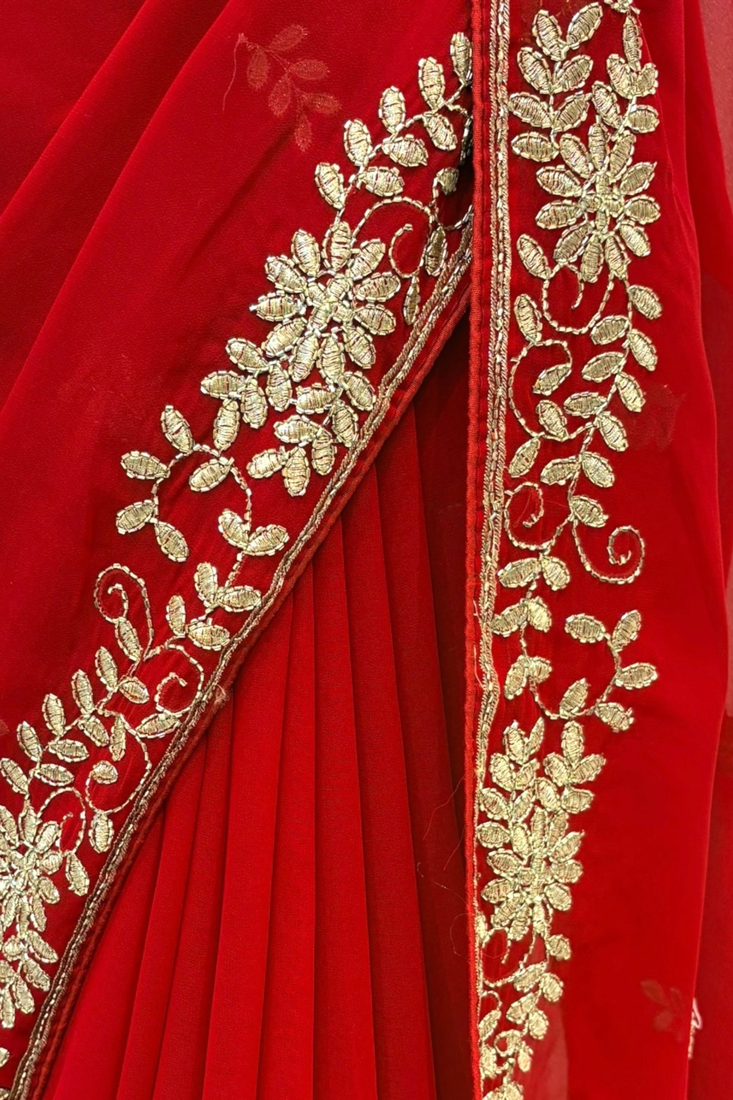 Red georgette zari embellished saree