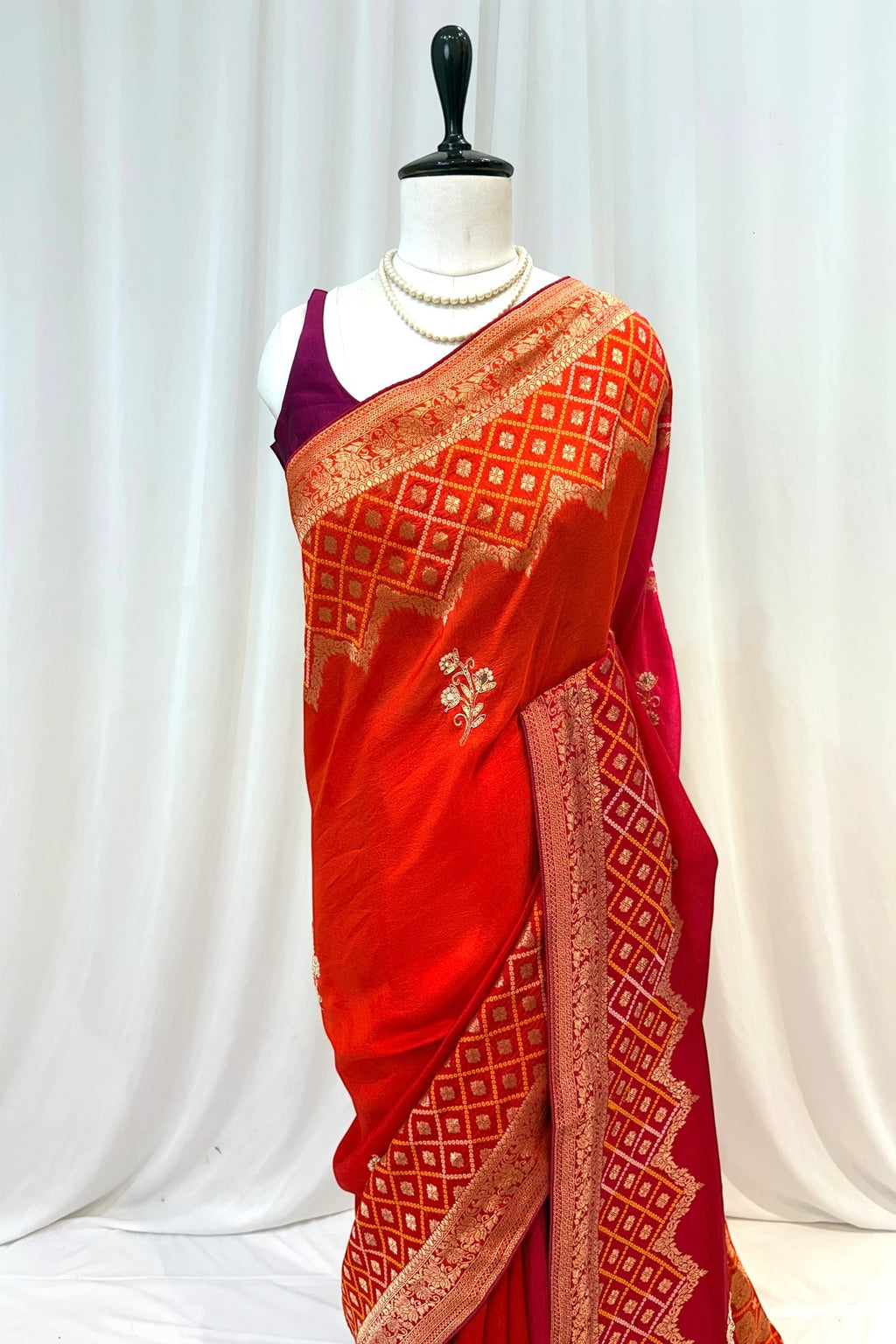 Orange-pink shaded pure dola silk saree