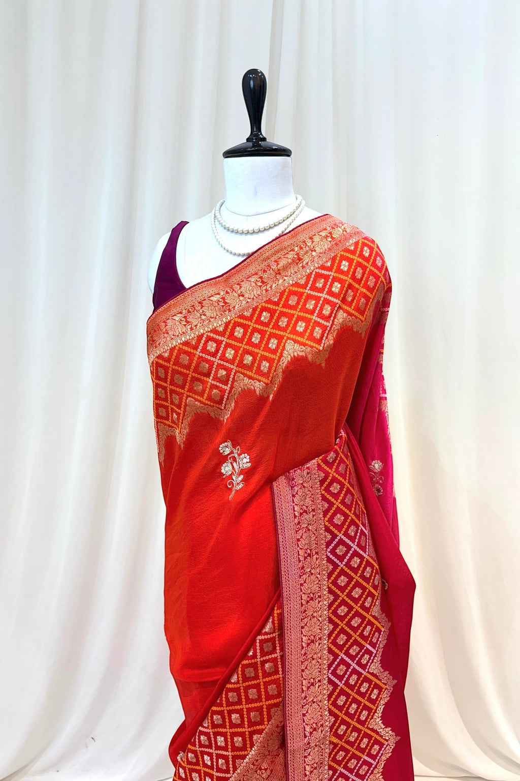Orange-pink shaded pure dola silk saree
