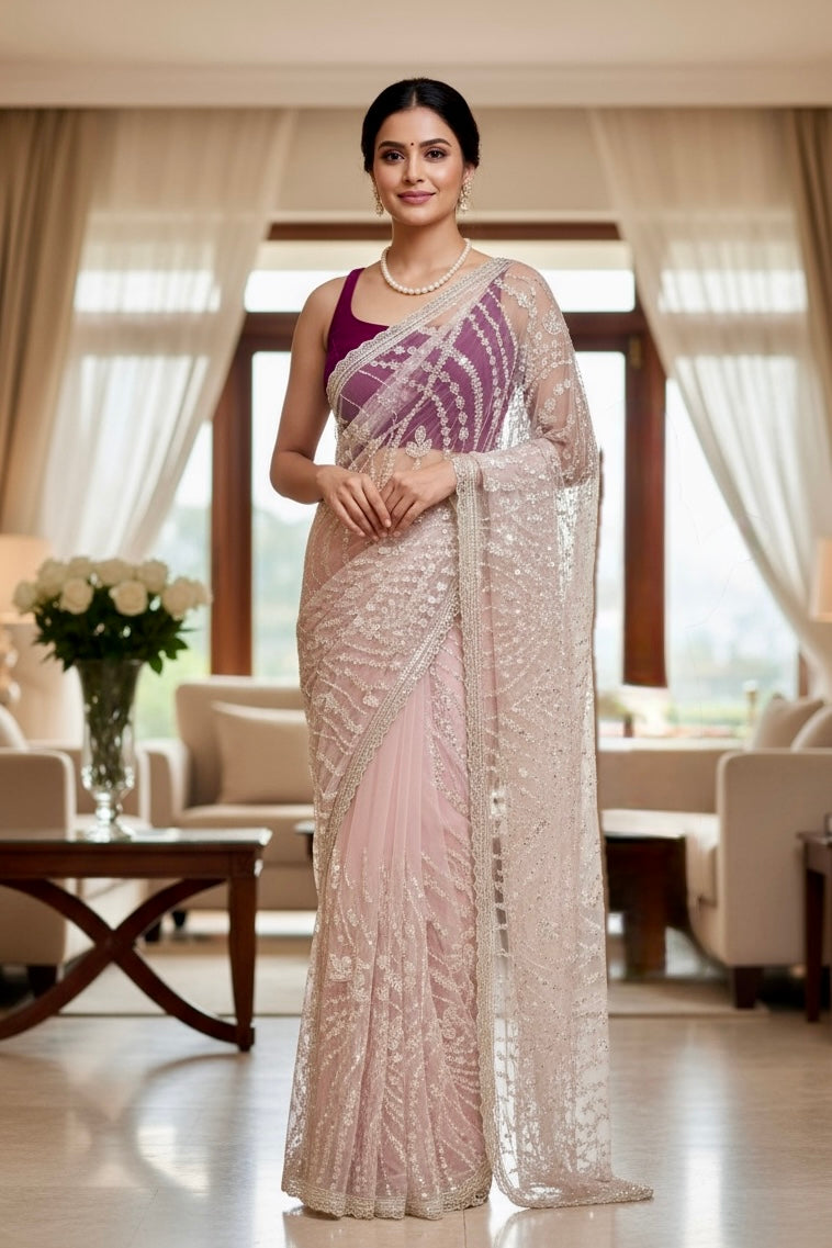 Pink sequins embellished net saree